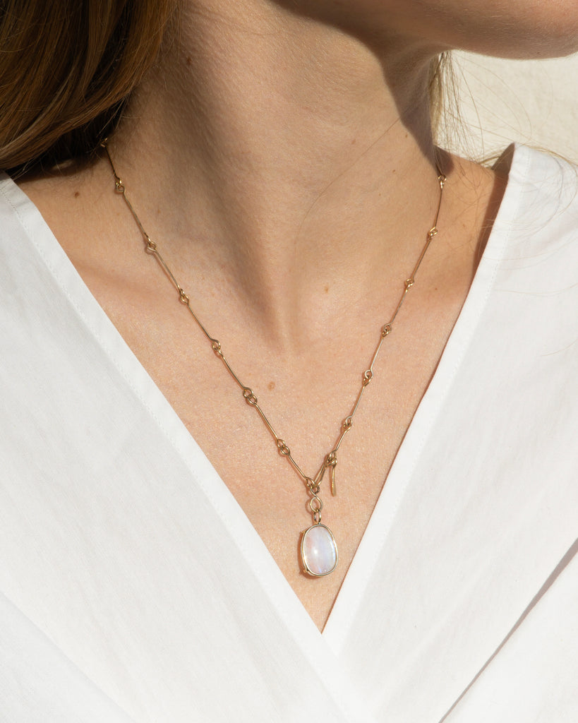 14k Floating Moonstone Bone Chain Pendant